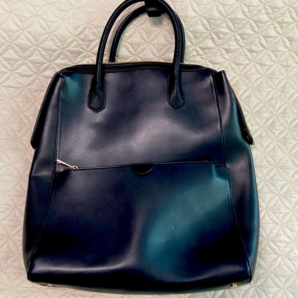 MAKE ME AN OFFER ON - 
Brand new laptop bag.  Converts from handbag to backpack.